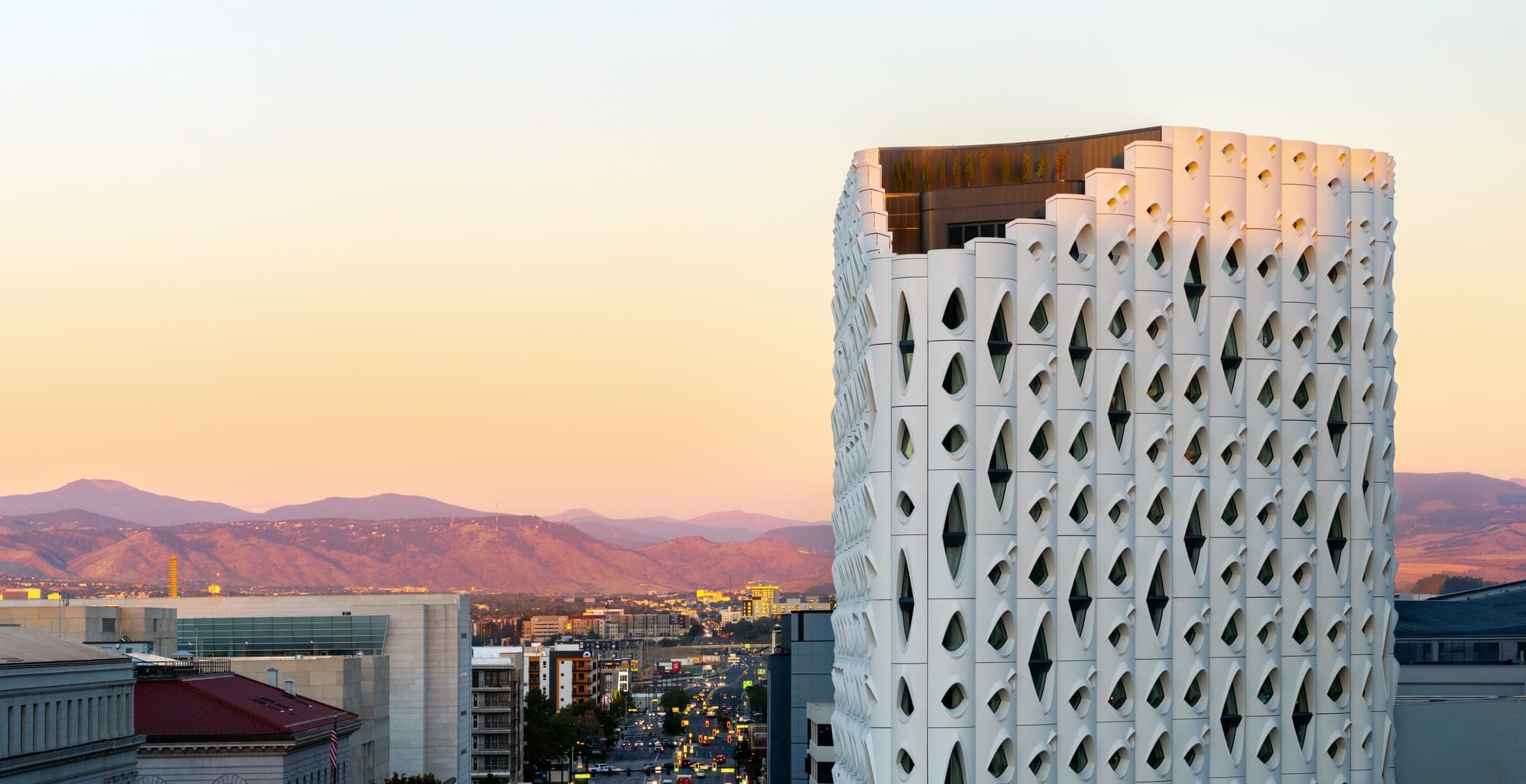 Populus Denver's tree-inspired facade in downtown Denver at dusk